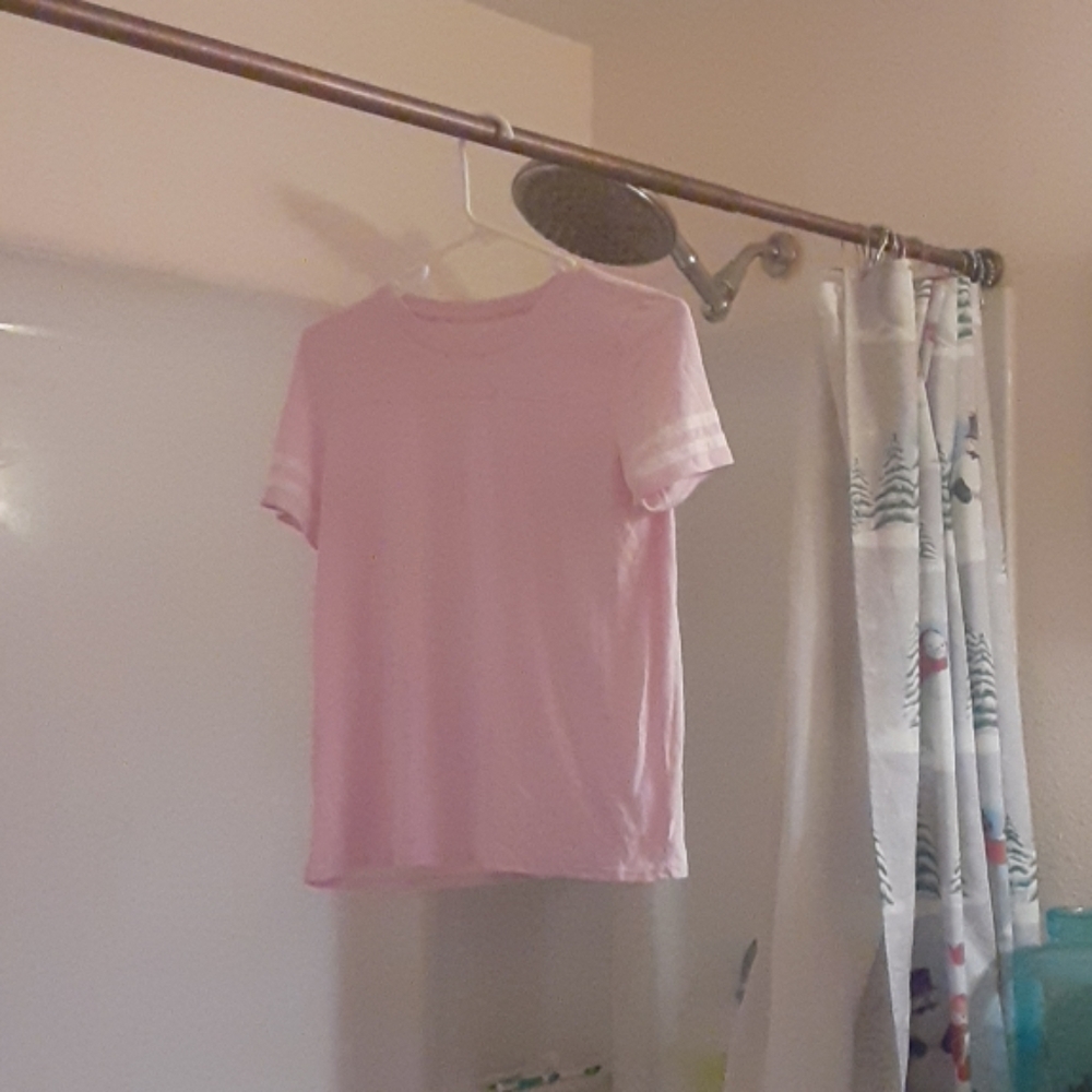I'm selling a light pink striped girl shirt.